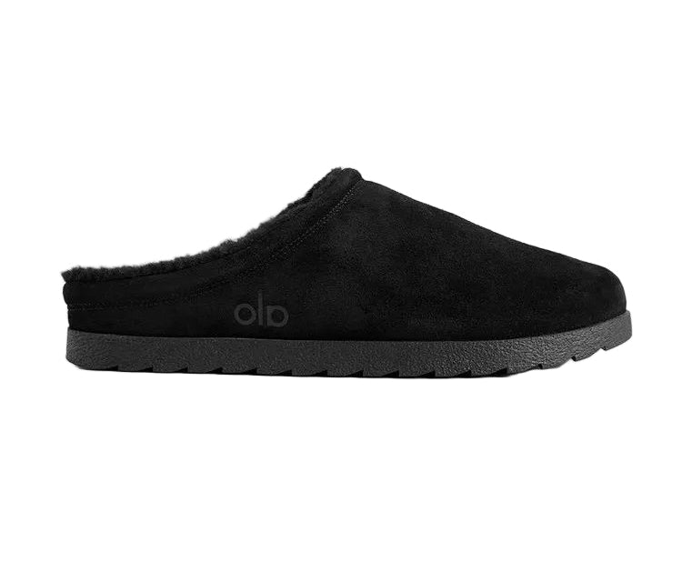 Alo Recovery Slipper in the black suede color with a faux fur lining.